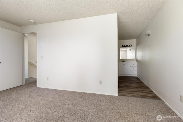 1234 NW Lanyard Loop Unit 1, Oak Harbor, WA 98277 - unfurnished bedroom featuring carpet flooring and a textured ceiling