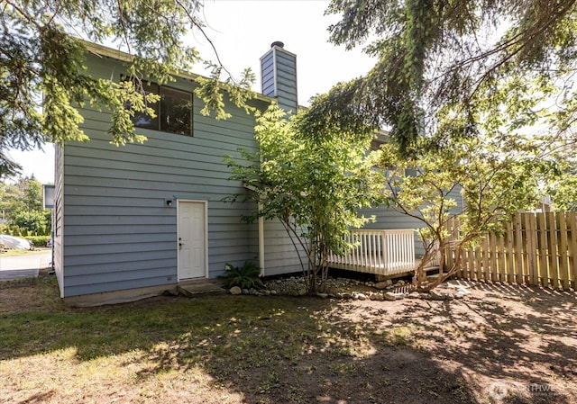 1234 NW Lanyard Loop Unit 1, Oak Harbor, WA 98277 - back of property with a chimney and a deck
