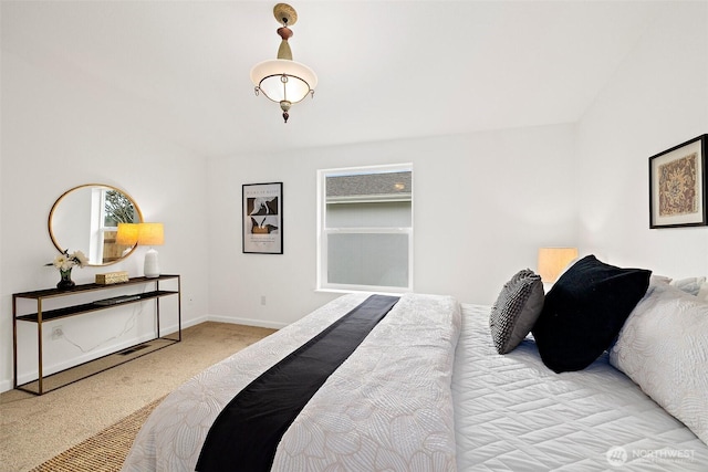 carpeted bedroom with baseboards