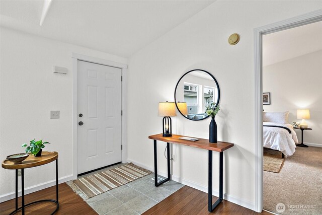 foyer featuring baseboards