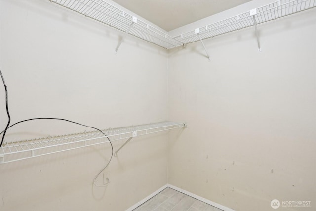 walk in closet featuring light wood-style floors