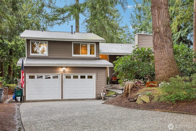 view of front facade featuring a garage, gravel driveway, and a chimney