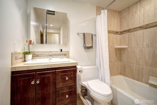 bathroom with shower / bath combo, vanity, toilet, and backsplash