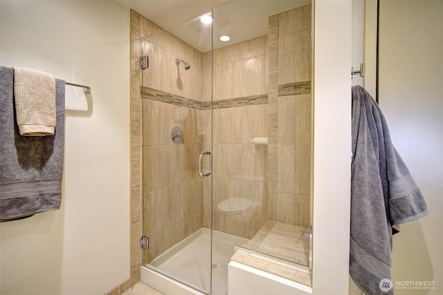 full bathroom featuring a shower stall