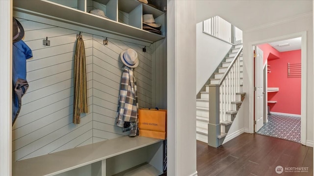 mudroom featuring baseboards, dark wood-style floors, and ornamental molding