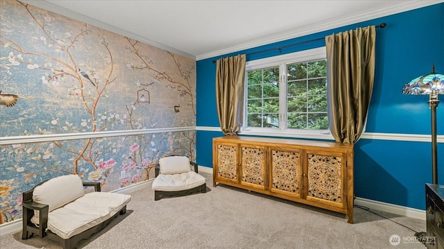 living area with carpet, crown molding, wallpapered walls, baseboards, and an accent wall