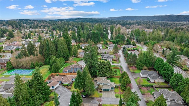 aerial view with a residential view and a wooded view