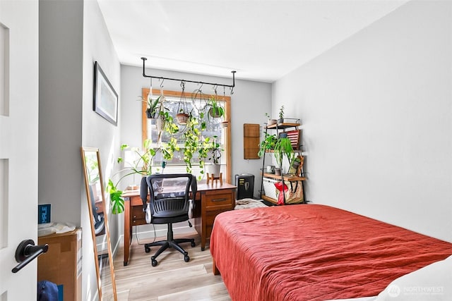 bedroom featuring light wood-type flooring