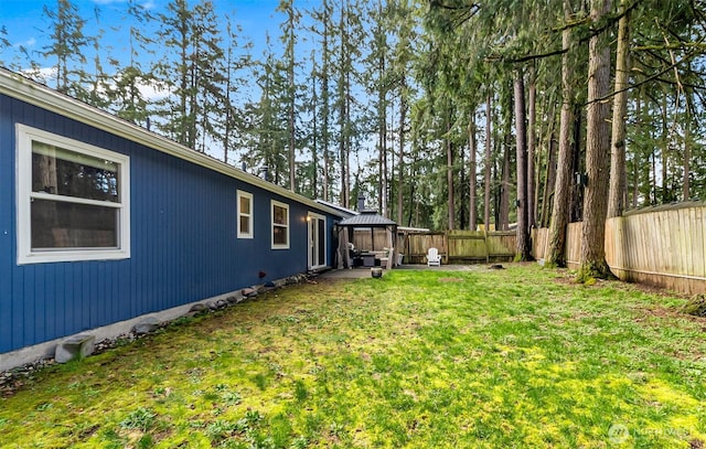 view of yard featuring a gazebo and fence private yard