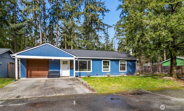 single story home with driveway, an attached garage, a front lawn, and fence