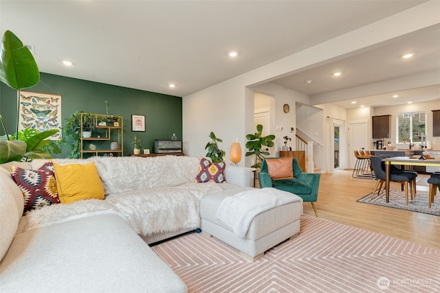 living room featuring stairway, recessed lighting, and light wood-style floors