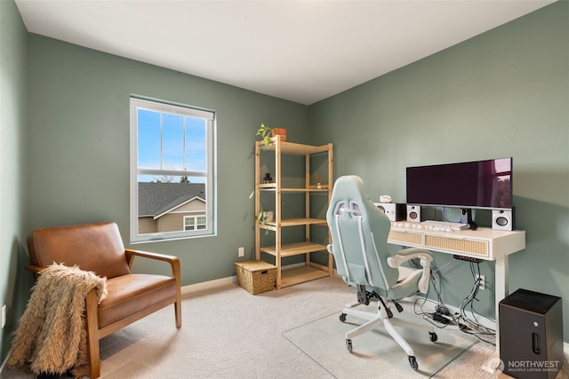 carpeted office featuring baseboards