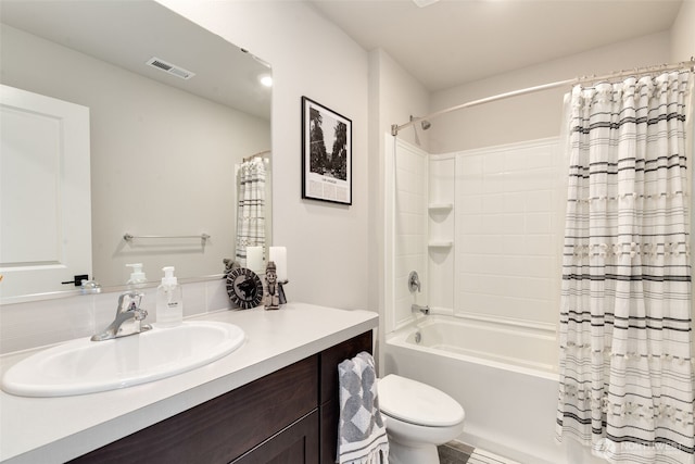 full bath featuring vanity, shower / bath combo with shower curtain, toilet, and visible vents