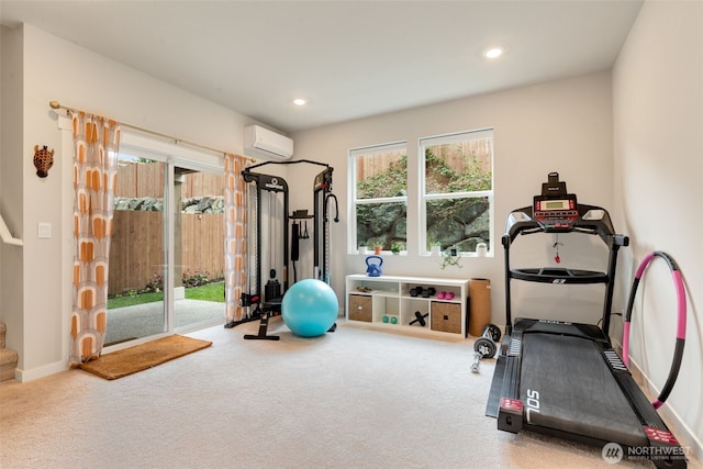 exercise room featuring an AC wall unit, recessed lighting, and carpet