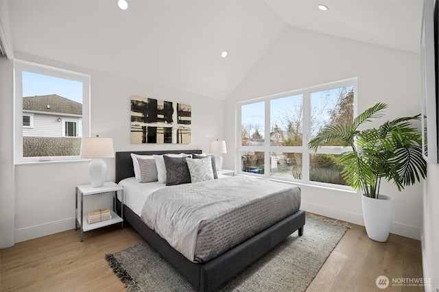 bedroom with recessed lighting, baseboards, high vaulted ceiling, and wood finished floors