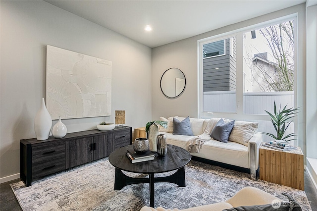 living room with recessed lighting and baseboards