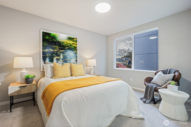 carpeted bedroom featuring baseboards