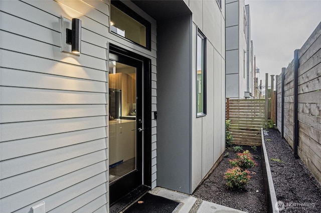 doorway to property with fence