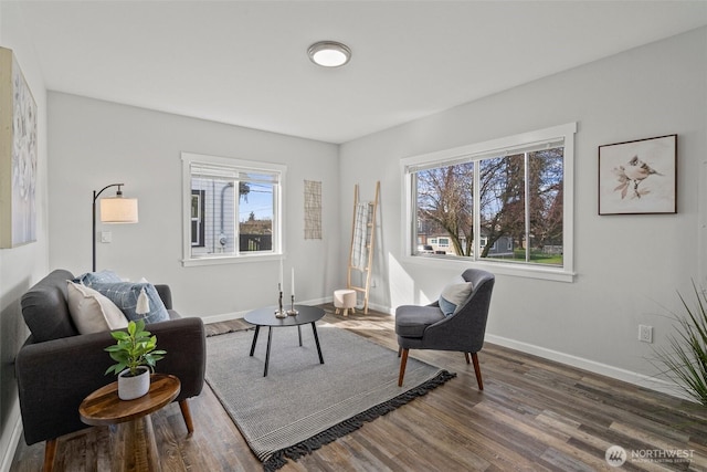 interior space featuring wood finished floors and baseboards