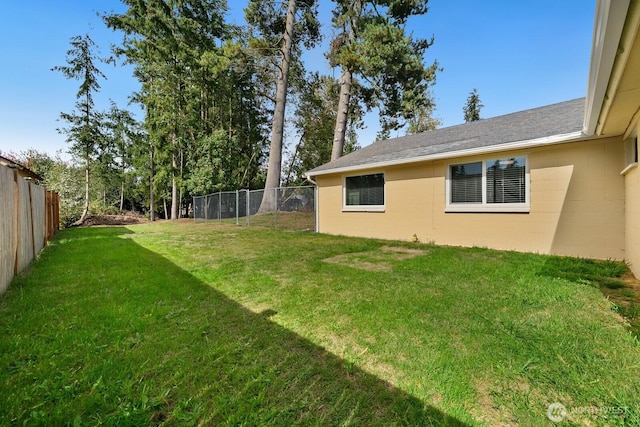 view of yard with a fenced backyard