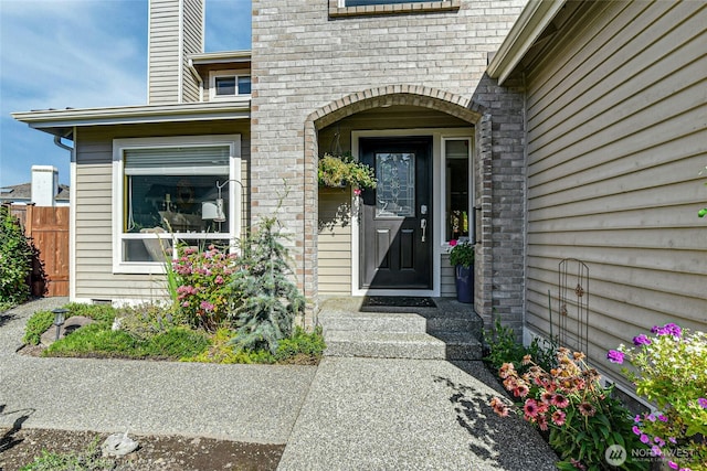 property entrance featuring fence