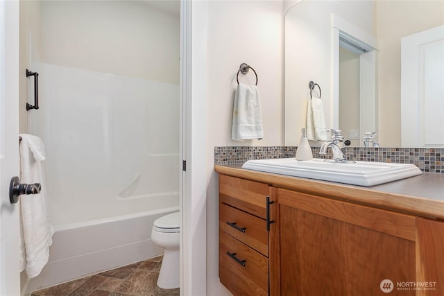 full bathroom with tasteful backsplash, tub / shower combination, toilet, and vanity