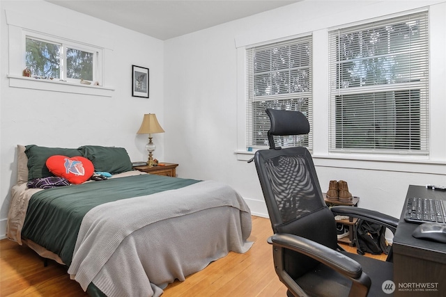 bedroom featuring wood finished floors