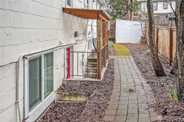 view of home's exterior with fence