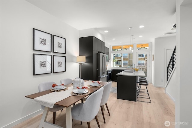 9211A Densmore Ave N, Seattle, WA 98103 - dining space featuring recessed lighting, baseboards, and light wood finished floors