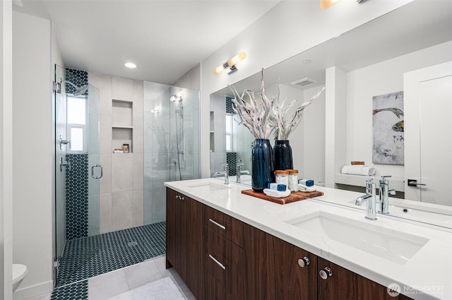 9211A Densmore Ave N, Seattle, WA 98103 - full bath with a shower stall, toilet, double vanity, and a sink