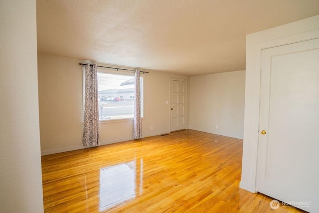 empty room featuring wood finished floors