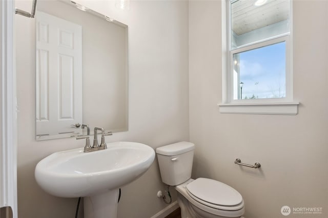 bathroom featuring toilet and a sink