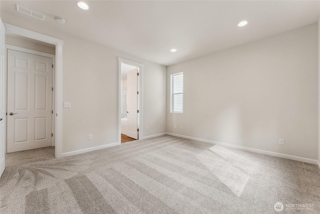 unfurnished room featuring recessed lighting, visible vents, carpet floors, and baseboards