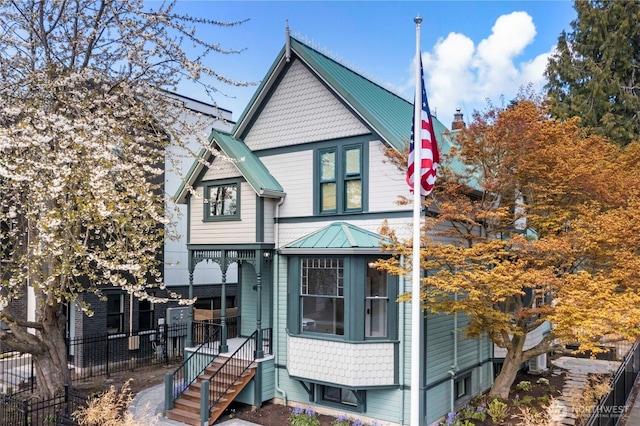 victorian home featuring metal roof