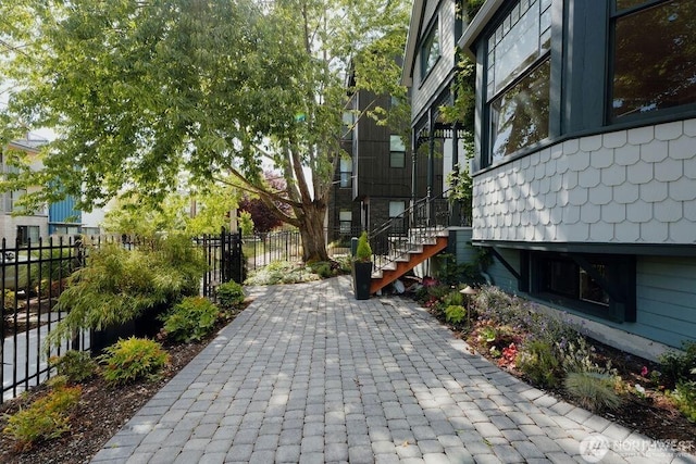 exterior space with stairway and fence