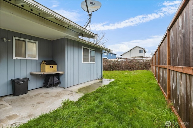 view of yard with a patio area and a fenced backyard