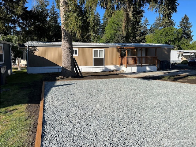 manufactured / mobile home featuring covered porch