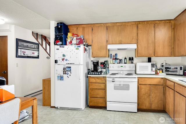 kitchen featuring white appliances, light countertops, brown cabinets, and under cabinet range hood