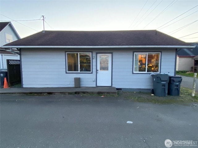 view of front of property with a shingled roof