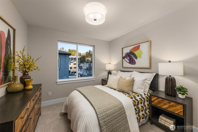 bedroom featuring baseboards and light colored carpet