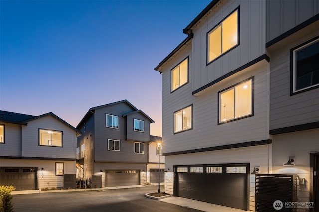 modern home featuring board and batten siding and an attached garage