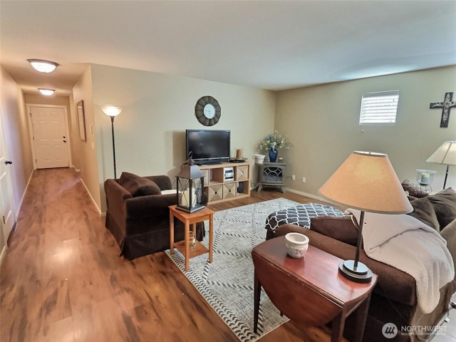 living area featuring wood finished floors and baseboards