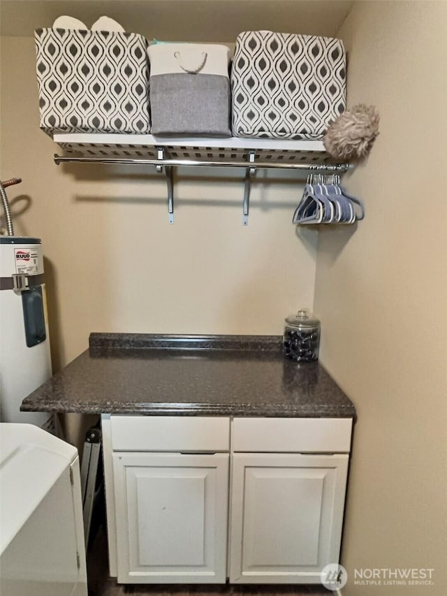 laundry area featuring electric water heater