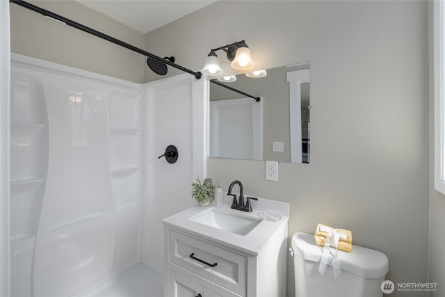 full bathroom with vanity and a shower