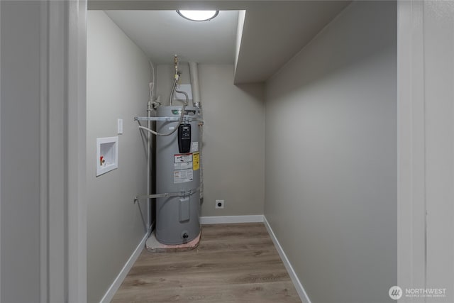 utility room with electric water heater