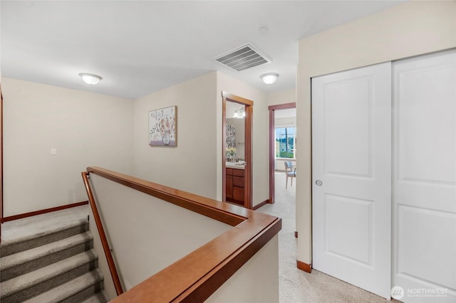 interior space featuring baseboards and visible vents