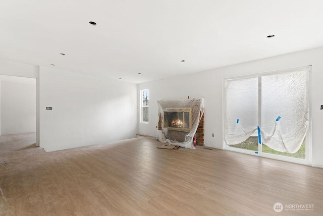 unfurnished living room with light wood-type flooring