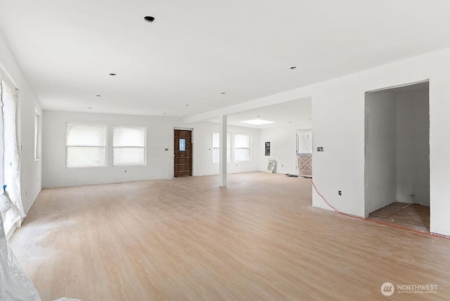 unfurnished living room with light wood-style floors