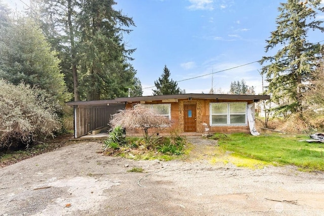 view of front of property with a carport