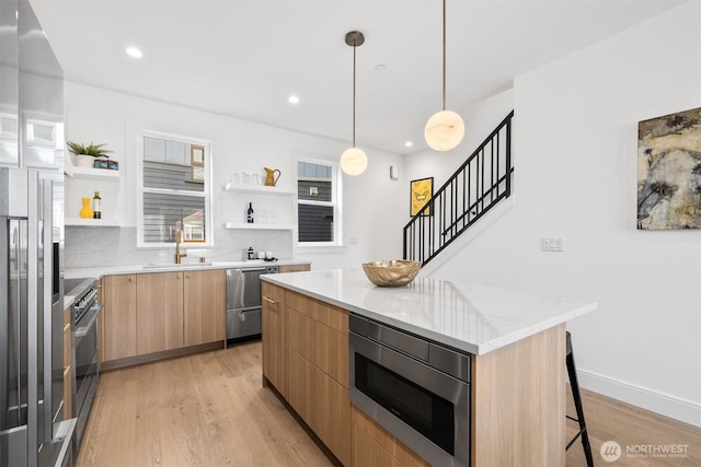 kitchen featuring open shelves, stainless steel appliances, modern cabinets, and a sink